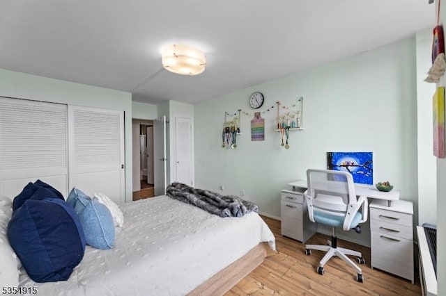 bedroom featuring light wood-style flooring