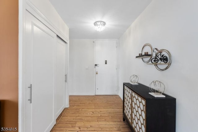 hallway featuring light wood-style flooring