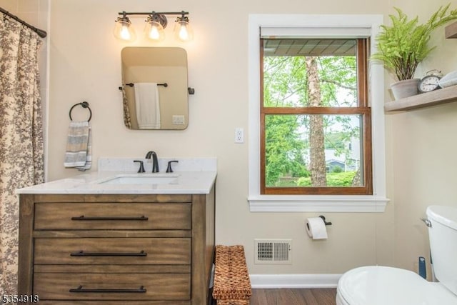12 Johnson Ave, Hopatcong Boro, NJ 07843 - bathroom with toilet, baseboards, wood finished floors, and vanity
