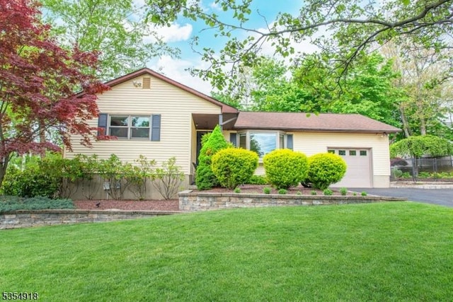 12 Johnson Ave, Hopatcong Boro, NJ 07843 - view of front facade featuring driveway, a garage, and a front lawn