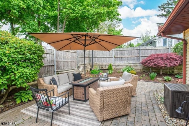 12 Johnson Ave, Hopatcong Boro, NJ 07843 - view of patio / terrace with an outdoor living space with a fire pit and fence