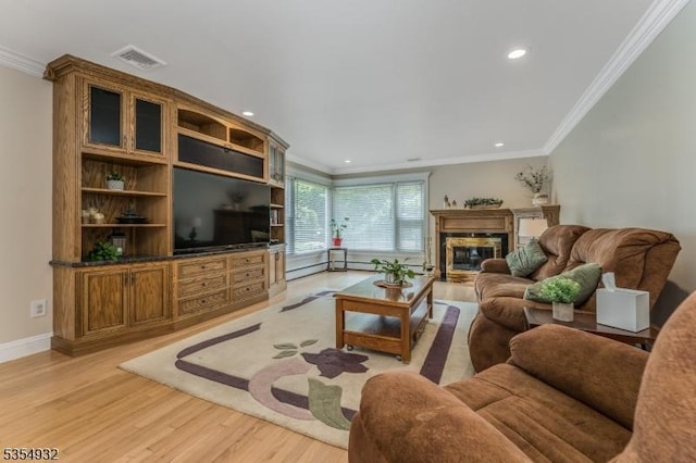 217 Long Hill Rd, Hillsborough Twp, NJ 08844 - living area with ornamental molding, light wood-type flooring, recessed lighting, a glass covered fireplace, and baseboards