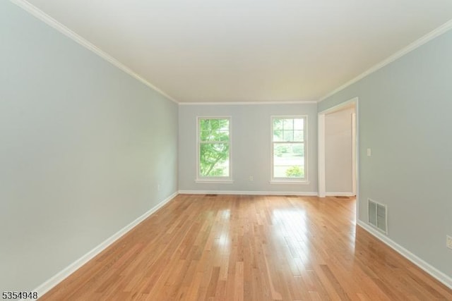 70 Crenshaw Dr, Mount Olive Twp, NJ 07836 - spare room featuring light wood-style floors and ornamental molding