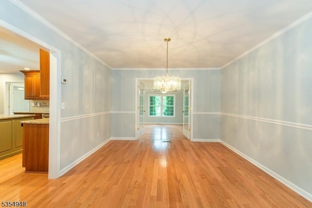 70 Crenshaw Dr, Mount Olive Twp, NJ 07836 - unfurnished dining area with a chandelier, light wood-type flooring, and crown molding