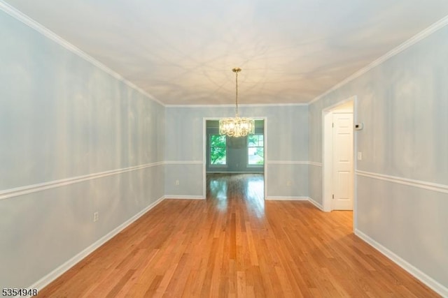 70 Crenshaw Dr, Mount Olive Twp, NJ 07836 - unfurnished dining area featuring a chandelier, wood finished floors, and ornamental molding