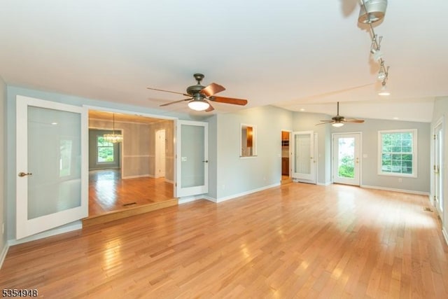 70 Crenshaw Dr, Mount Olive Twp, NJ 07836 - unfurnished living room featuring light wood-style flooring, a ceiling fan, and plenty of natural light