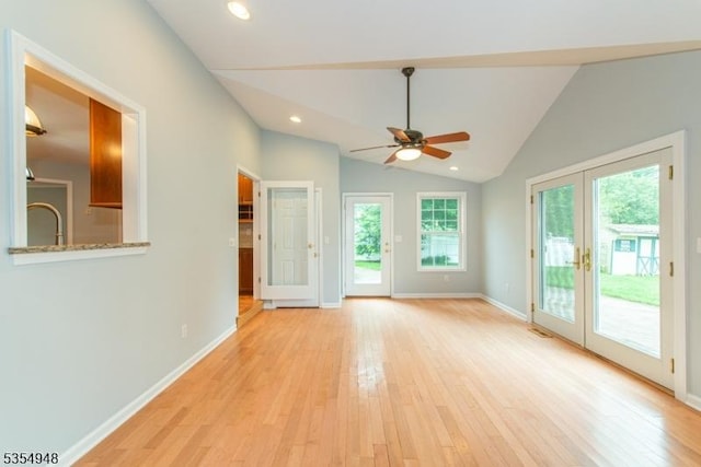 70 Crenshaw Dr, Mount Olive Twp, NJ 07836 - unfurnished living room with french doors, ceiling fan, light wood-type flooring, lofted ceiling, and recessed lighting