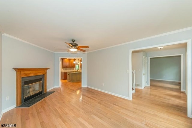 70 Crenshaw Dr, Mount Olive Twp, NJ 07836 - unfurnished living room featuring light wood finished floors, ceiling fan, a fireplace with flush hearth, and crown molding