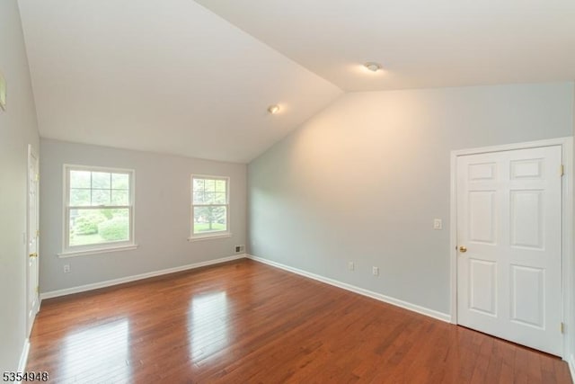 70 Crenshaw Dr, Mount Olive Twp, NJ 07836 - spare room with lofted ceiling and wood finished floors
