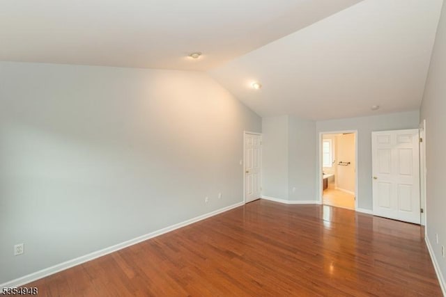 70 Crenshaw Dr, Mount Olive Twp, NJ 07836 - spare room with vaulted ceiling and wood finished floors