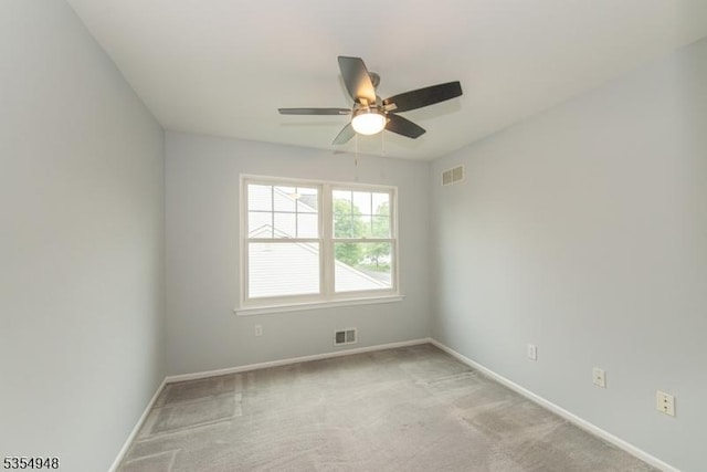 70 Crenshaw Dr, Mount Olive Twp, NJ 07836 - spare room featuring a ceiling fan and light carpet