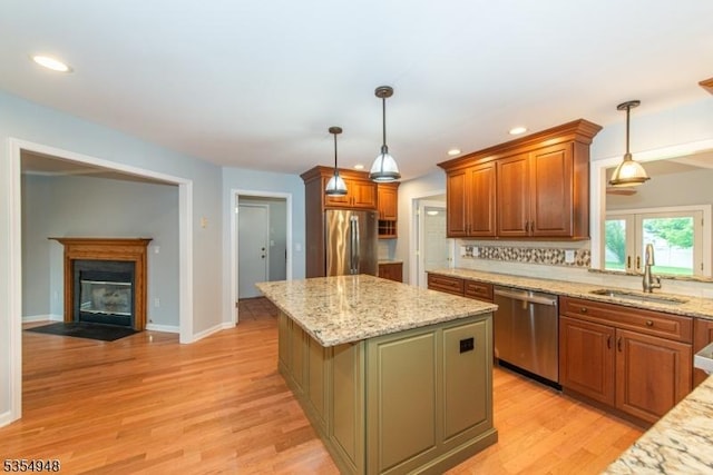 70 Crenshaw Dr, Mount Olive Twp, NJ 07836 - kitchen featuring stainless steel appliances, a kitchen island, light wood-type flooring, light stone counters, and recessed lighting