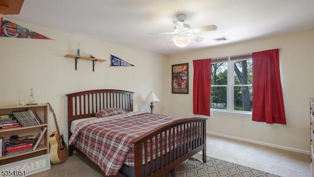 bedroom featuring visible vents, baseboards, carpet floors, and ceiling fan