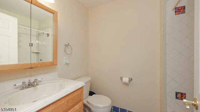 full bath featuring vanity, walk in shower, and toilet