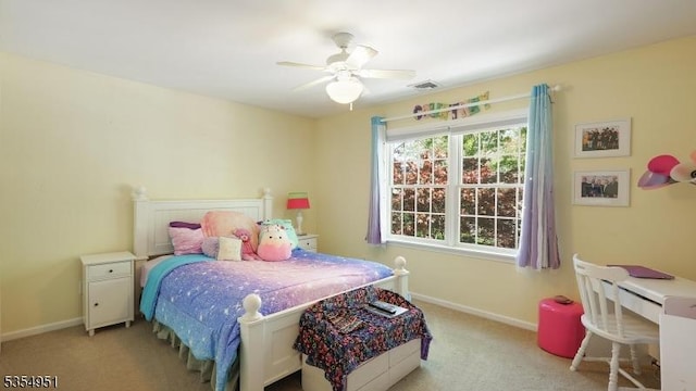 bedroom featuring carpet floors, a ceiling fan, baseboards, and visible vents