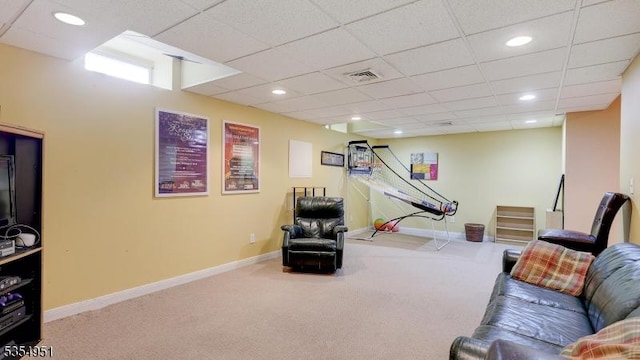 carpeted living area with baseboards, a drop ceiling, recessed lighting, and visible vents