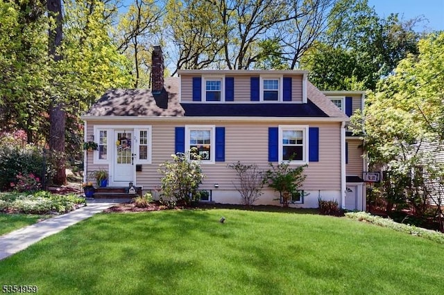 bungalow-style home featuring a front yard