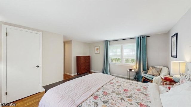 bedroom featuring light wood finished floors