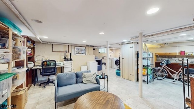 basement featuring separate washer and dryer and recessed lighting