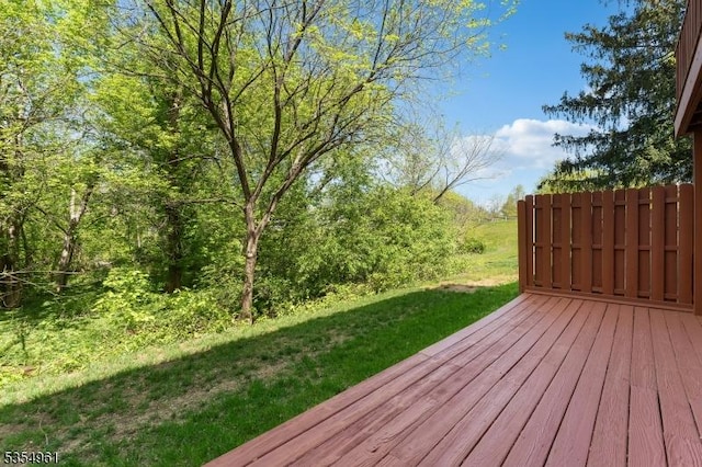wooden deck with a yard