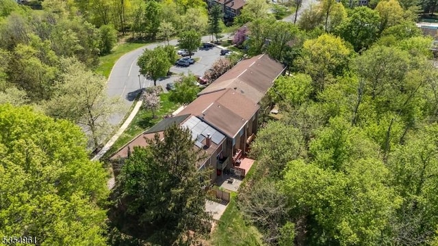 drone / aerial view featuring a forest view