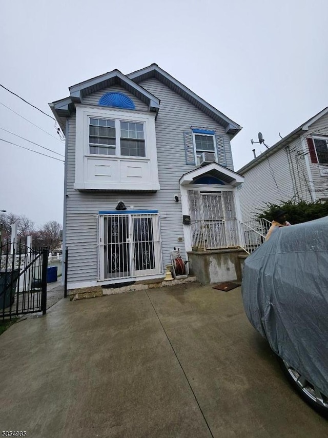 back of house with fence