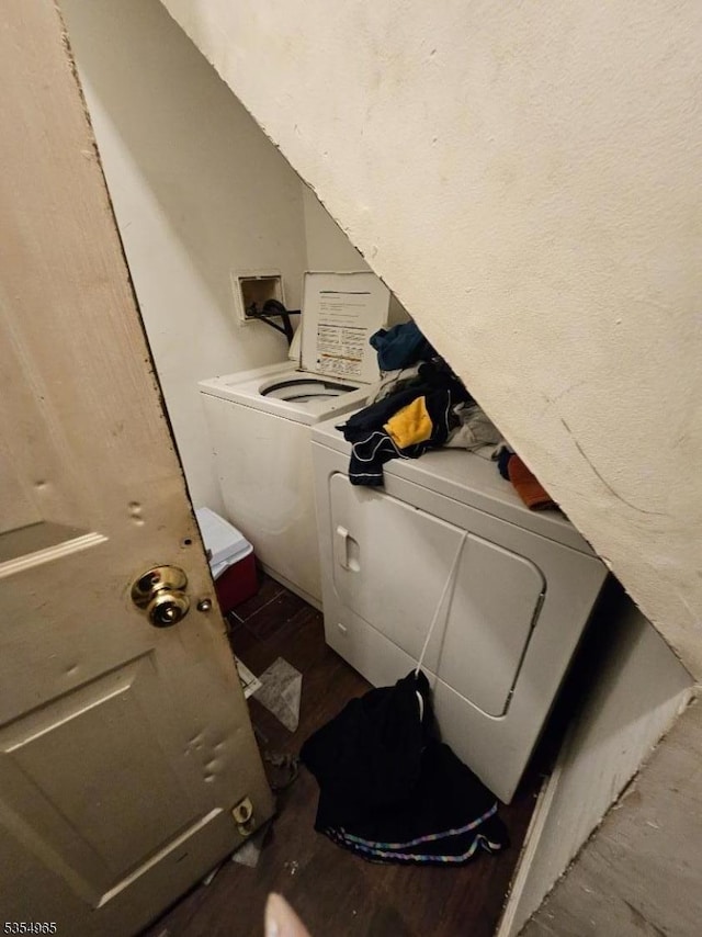 washroom featuring washer and dryer and wood finished floors