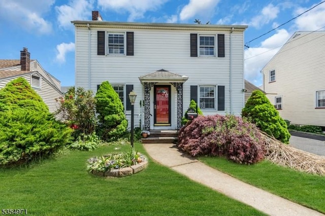 123 Robbinwood Ter, Linden City, NJ 07036 - view of front facade with a front lawn and a chimney