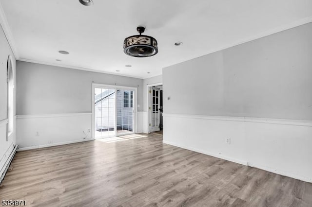 123 Robbinwood Ter, Linden City, NJ 07036 - empty room with wood finished floors, baseboard heating, crown molding, and baseboards