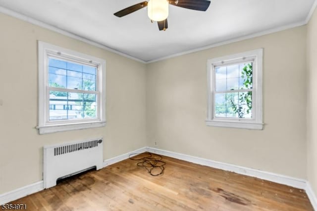 123 Robbinwood Ter, Linden City, NJ 07036 - empty room featuring radiator heating unit, ornamental molding, baseboards, and a ceiling fan