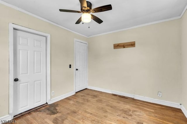 123 Robbinwood Ter, Linden City, NJ 07036 - unfurnished bedroom featuring baseboards, crown molding, wood finished floors, ceiling fan, and a closet