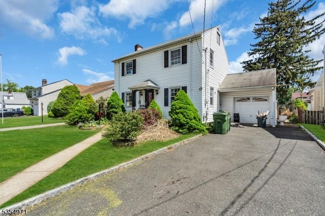 123 Robbinwood Ter, Linden City, NJ 07036 - colonial inspired home featuring an attached garage, asphalt driveway, and a chimney