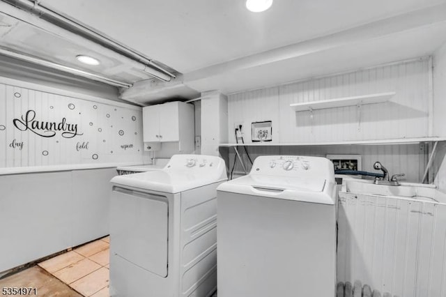 123 Robbinwood Ter, Linden City, NJ 07036 - laundry room with independent washer and dryer, cabinet space, and light tile patterned floors