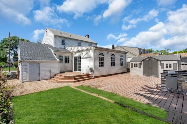 123 Robbinwood Ter, Linden City, NJ 07036 - back of property with a storage shed, a deck, an outdoor structure, and a lawn