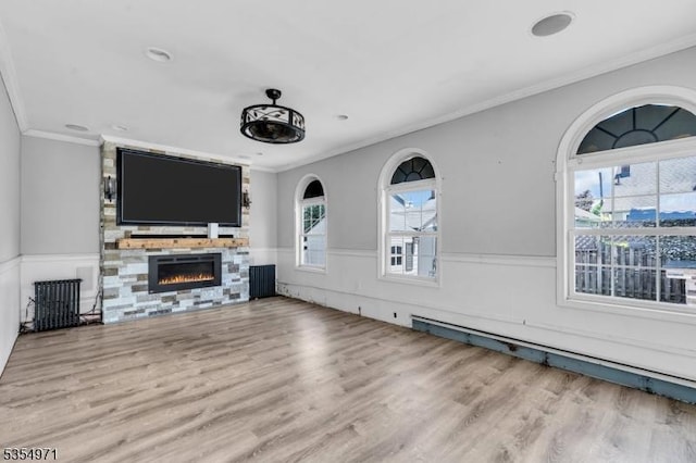 123 Robbinwood Ter, Linden City, NJ 07036 - unfurnished living room with wood finished floors, a fireplace, a wainscoted wall, and ornamental molding