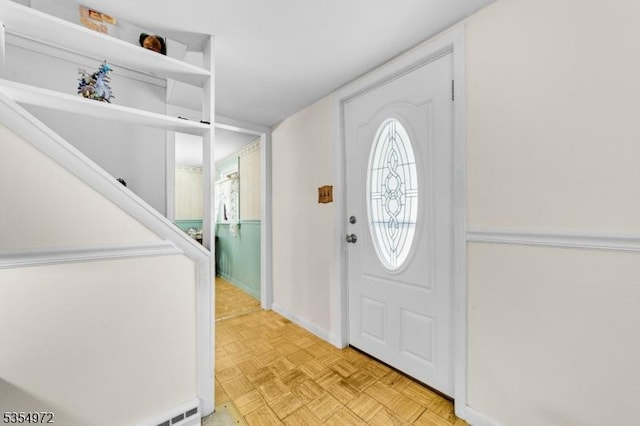 entryway featuring baseboards
