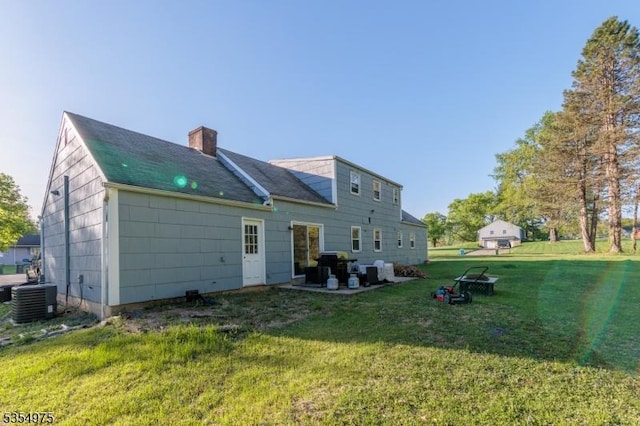 908 Maple Dr, Greenwich Twp, NJ 08886 - rear view of house featuring a lawn, central air condition unit, a chimney, and a patio