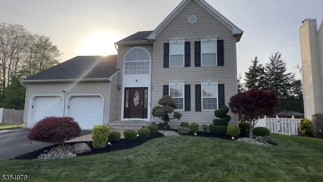 8 Congress Ln, South River Boro, NJ 08882 - view of front of property with an attached garage, a front lawn, fence, and driveway