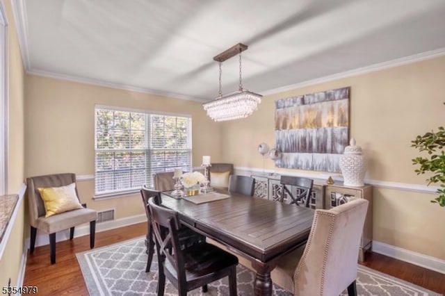 8 Congress Ln, South River Boro, NJ 08882 - dining area featuring baseboards, ornamental molding, wood finished floors, and visible vents