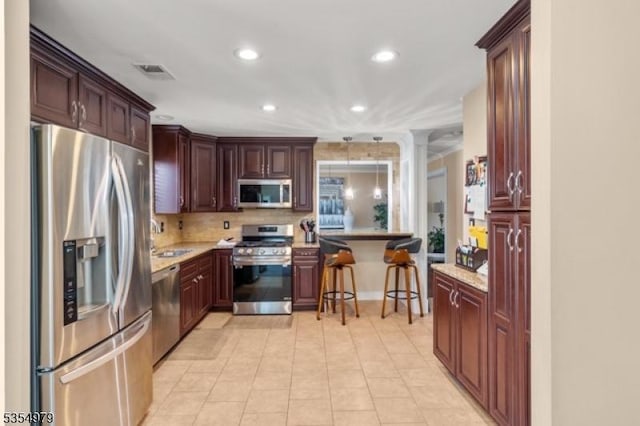 8 Congress Ln, South River Boro, NJ 08882 - kitchen with visible vents, a kitchen breakfast bar, recessed lighting, tasteful backsplash, and stainless steel appliances