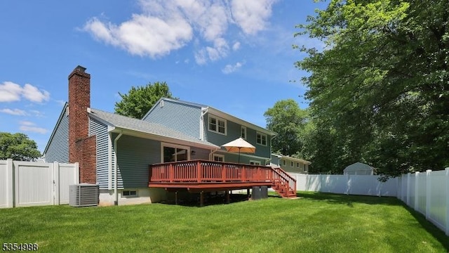 3 Grant St, Cranford Twp, NJ 07016 - back of property with a deck, central AC unit, and a chimney