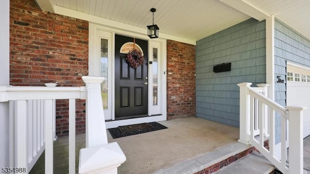 3 Grant St, Cranford Twp, NJ 07016 - doorway to property featuring a porch and brick siding