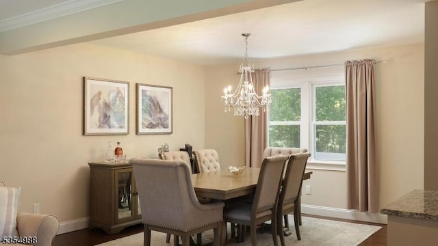 3 Grant St, Cranford Twp, NJ 07016 - dining room featuring baseboards, a chandelier, dark wood-style floors, and crown molding