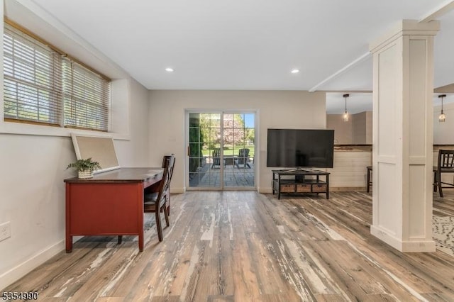office area featuring baseboards, recessed lighting, and wood finished floors