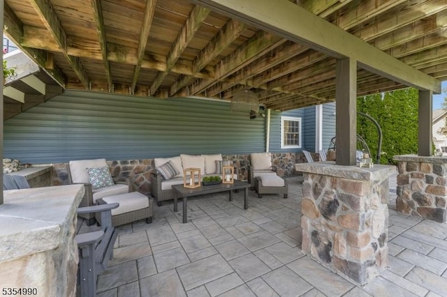 view of patio featuring an outdoor hangout area and outdoor dry bar