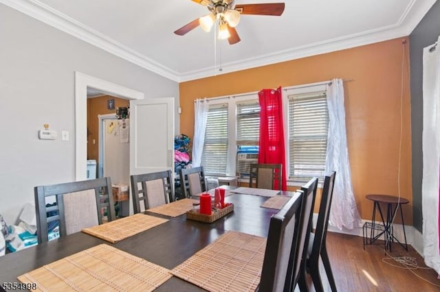 dining space with ceiling fan, ornamental molding, and wood finished floors