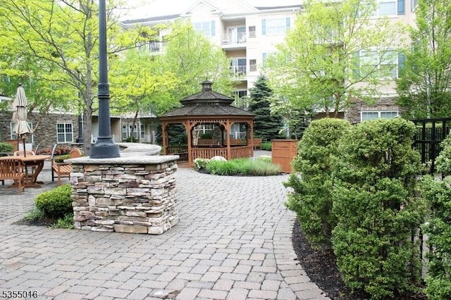 view of property's community with a patio and a gazebo