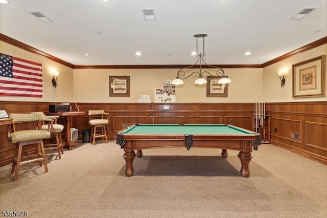 rec room featuring ornamental molding, light carpet, wainscoting, and visible vents
