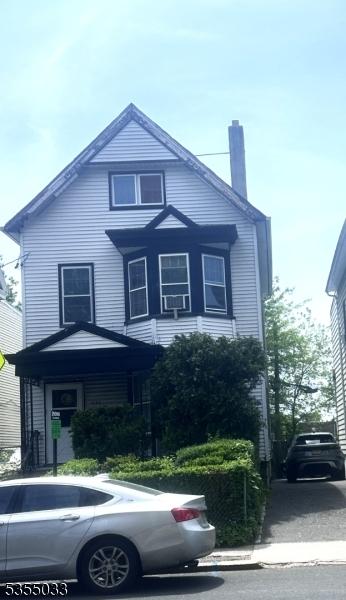 1148 Clinton Ave, Irvington Twp, NJ 07111 - view of front of home with a chimney