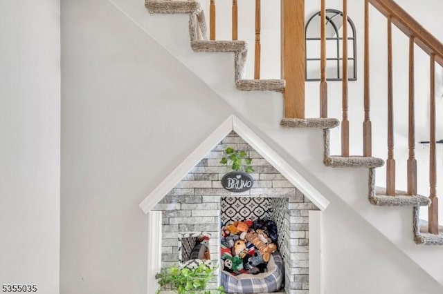 bar featuring stairway and a fireplace